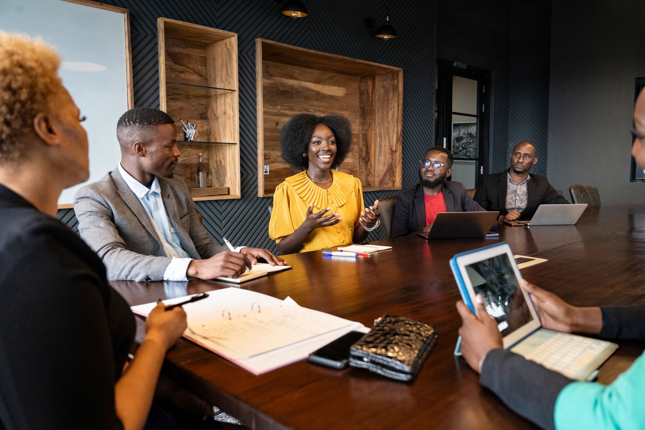 Person speaking during a meeting, sharing ideas