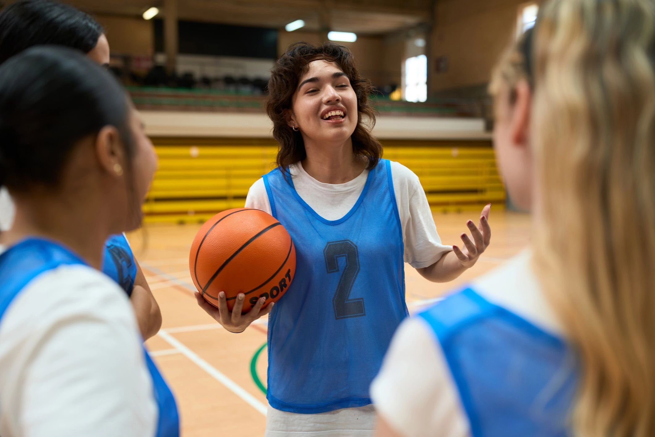 Basketball player explaining strategy to teammates